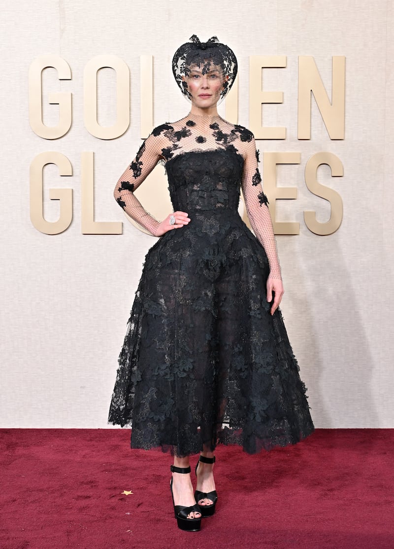 Rosamund Pike attends the 81st Annual Golden Globe Awards wearing Dior.