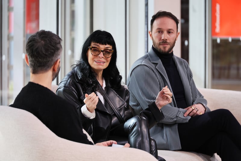 A man and a woman on a panel discussion
